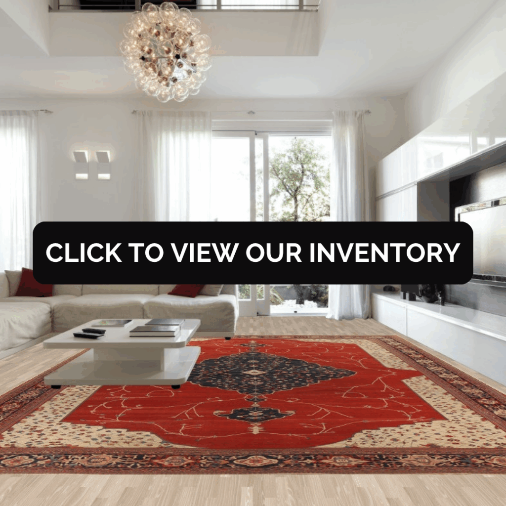 A spacious modern living room with a cream sectional sofa and glass chandelier, featuring a bold red Persian-style rug with an intricate navy and cream medallion design. The text overlay reads, “Click to view our inventory.”